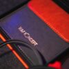 Elegant red and gray wallet showcasing premium craftsmanship with sewing details.