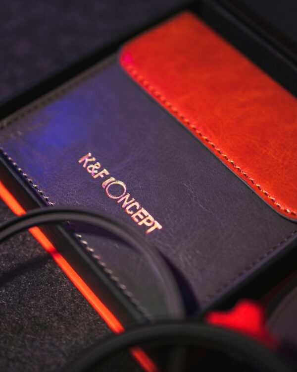 Elegant red and gray wallet showcasing premium craftsmanship with sewing details.